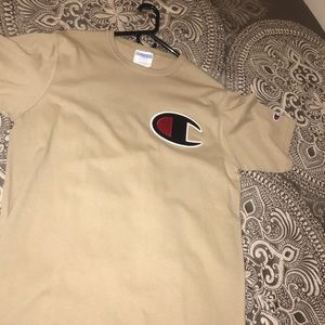 Beige colored champion shirt